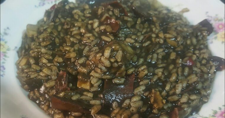 Indulge in Spanish Cuisine: Arroz Negro con Chipirones Cooked in Olla GM