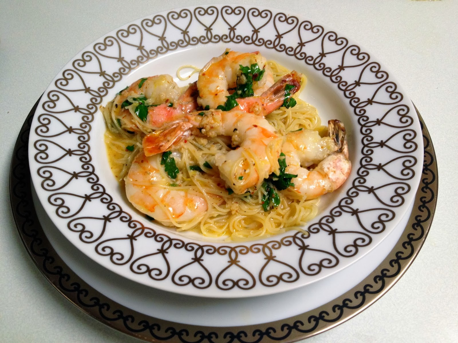 Savor the Flavors of Spain with Tallarines con Gambas al Ajillo con MAMBO