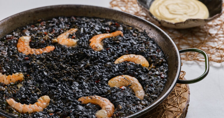 Indulge in the Rich Flavors of Arroz Negro con Chipirones at MAMBO